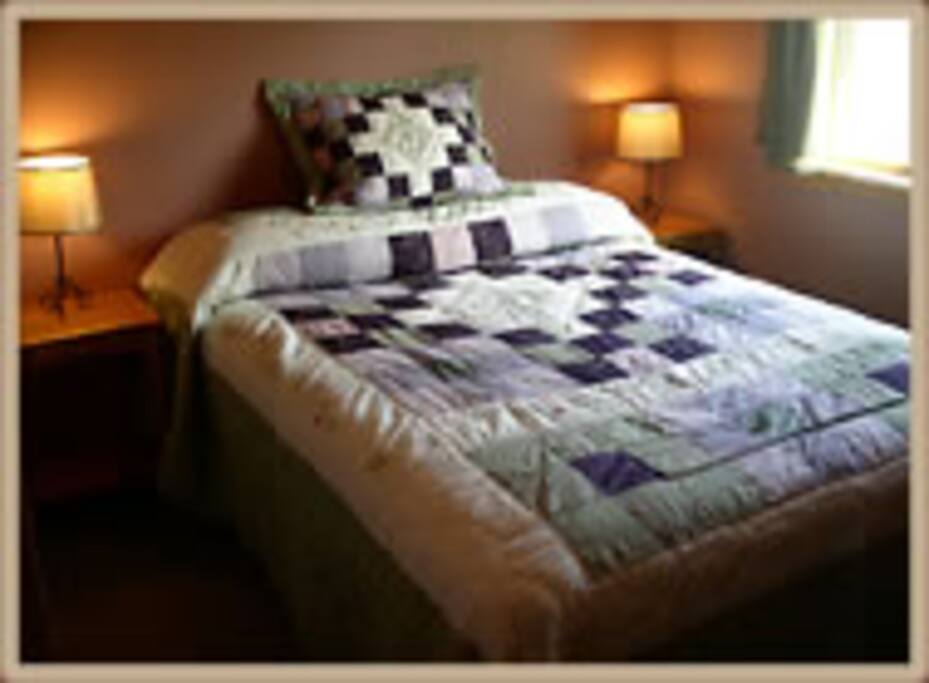 Queen bed in the first bedroom.