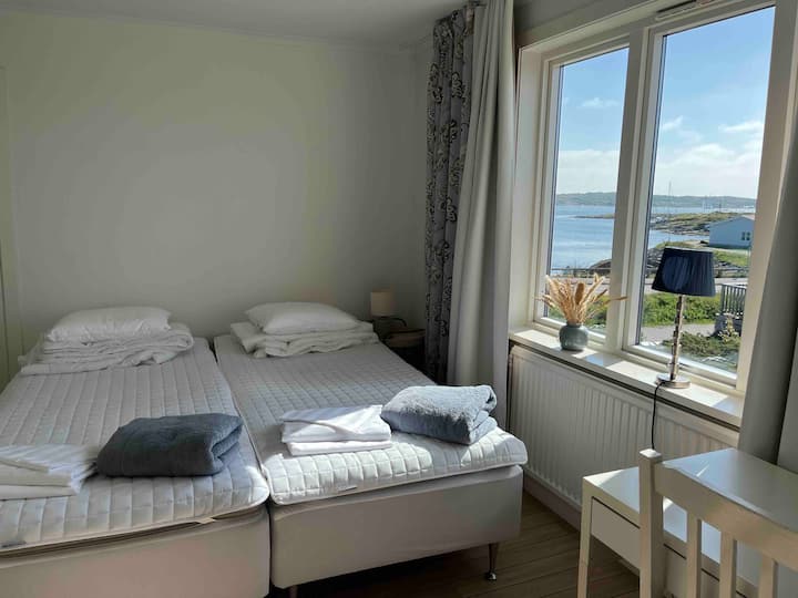 Bedroom 2  has nice sea view! So there is a double bed (2 beds of 90 x 200 cm, medium firm). A bedside table and bedside lamp. From this bedroom there is also an entrance to the dressing room.