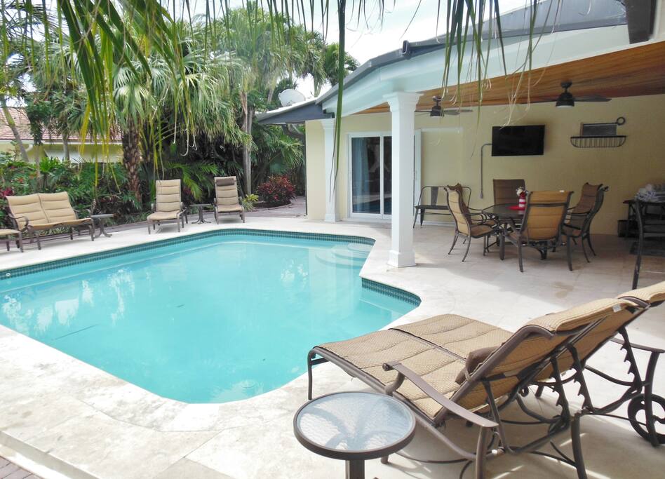 Enjoy the large, heated pool while watching TV poolside.