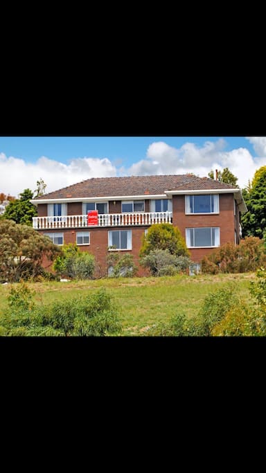 front view of the house - top level is the 4 bdrm house with balcony