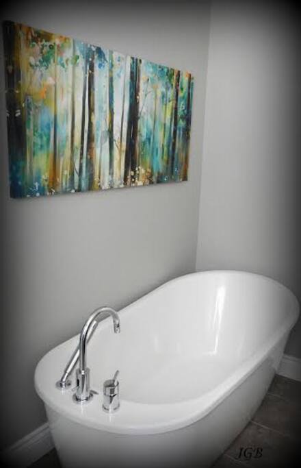 Newly renovated luxurious bathroom with soaker tub and separate shower.
