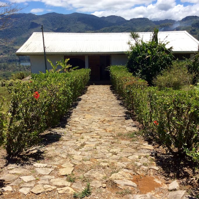 Cobblestone path from the parking area to the villa