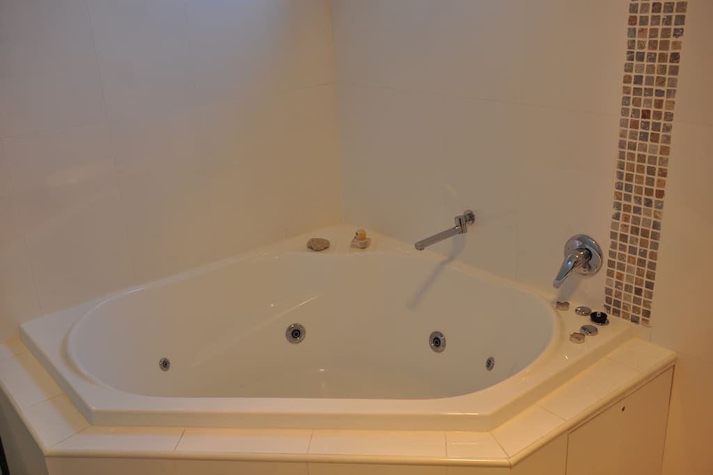 En-suite bathroom with spa and shower separate to spa
