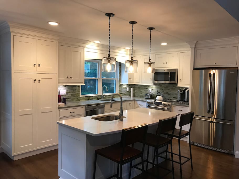 Gourmet Kitchen with stainless steel appliances, Caesar-stone countertops and eat-in island.
Fully stocked Keurig machine