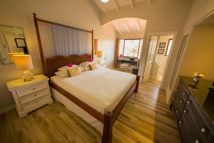Master bedroom with comfy king bed and small ensuite bathroom