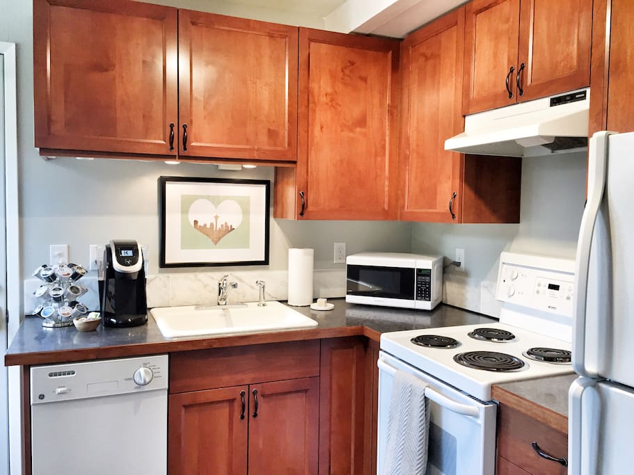 Fully stocked kitchen with dishwasher, microwave, all utensils and small appliances