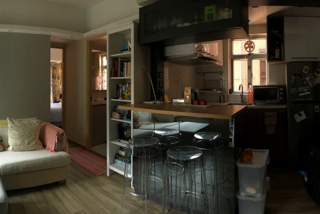 Panorama shot of the living room, bar and kitchenette