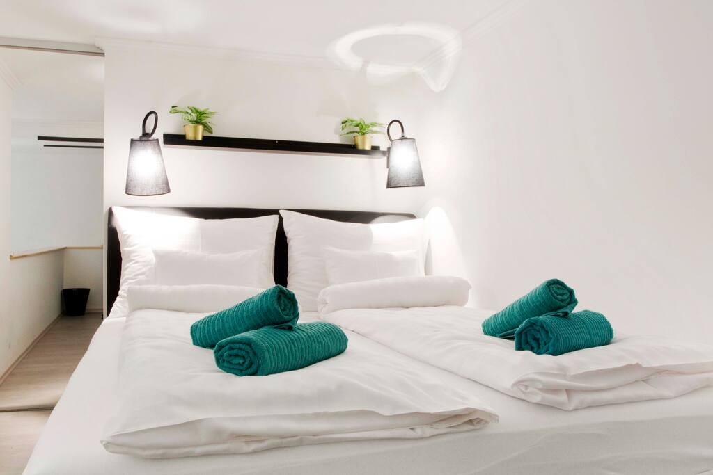 The loft bed (160x200cm) and the hidden wardrobe behind