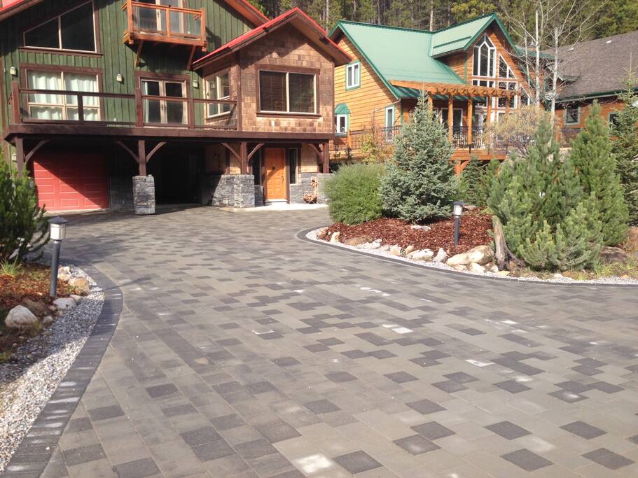 Very large driveway can accommodate multiple vehicles.