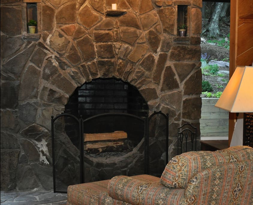 The hand-built stone fireplace