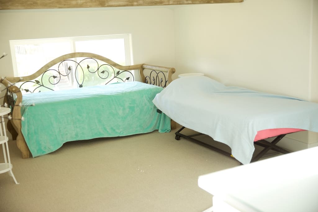 Upstairs bedroom with two twins that convert to king