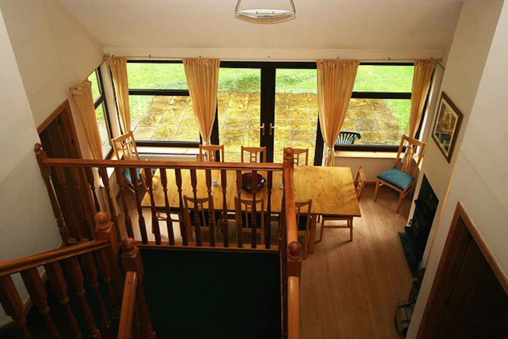 The upstairs landing overlooks the dining room