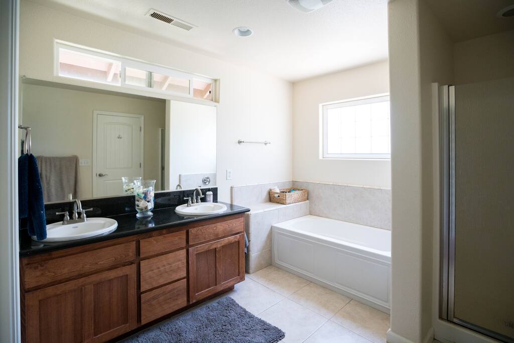 Master bath, shower and double vanity sink.
