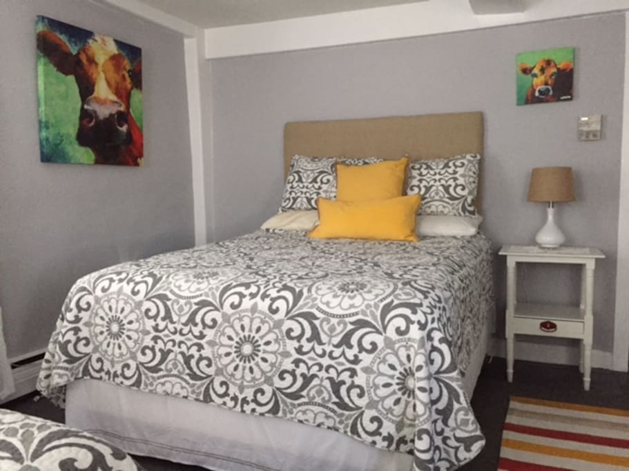 A room designed around a cow print.