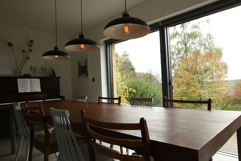 Open plan dining area with 9ft teak table