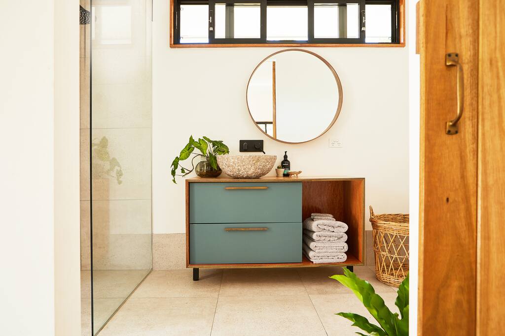 Deluxe bathroom with entry to outdoor bath and giant tree top verandah
