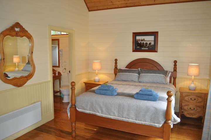 Luxuriously appointed bedroom with queen size bed