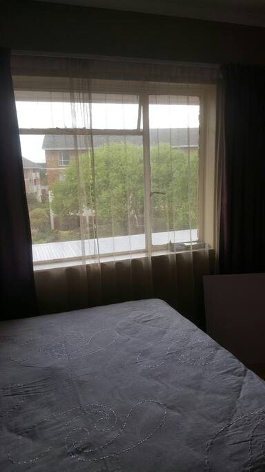 Guest bedroom with a double bed and a study desk
