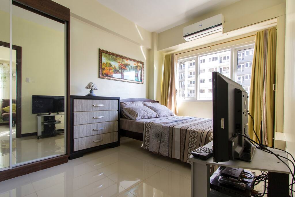 The bedroom, complete with beddings.