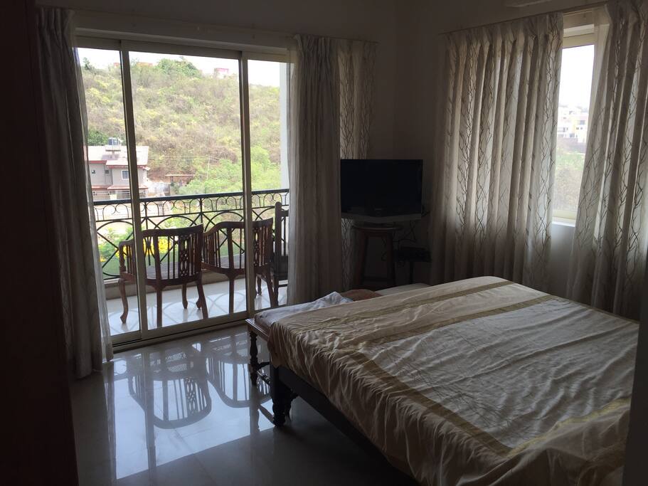 TV in room with balcony