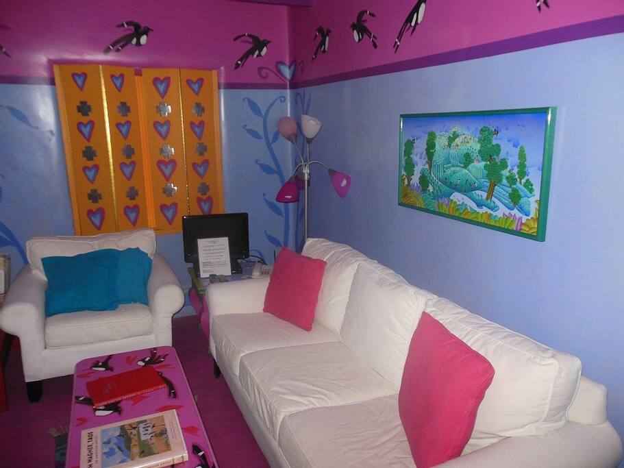 The living room is colorful and comfortable.