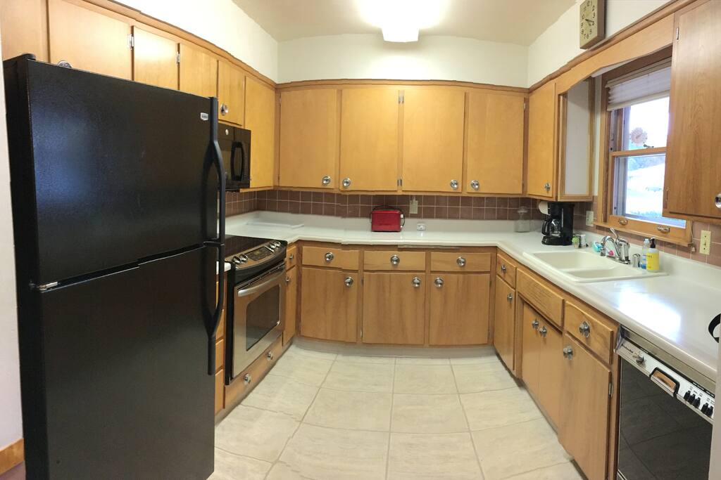 The fully equipped kitchen comes with everything you'd expect - coffee maker, toaster, and all the dishes and cookware you'll need. There's a roomy fridge for food and beverages you bring, and a dishwasher to ease some of the cleanup work.