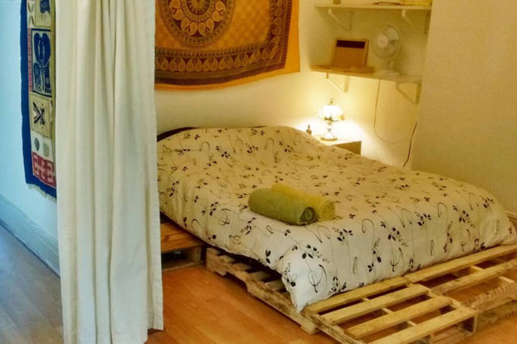 This is the main bedroom with a queen size bed.