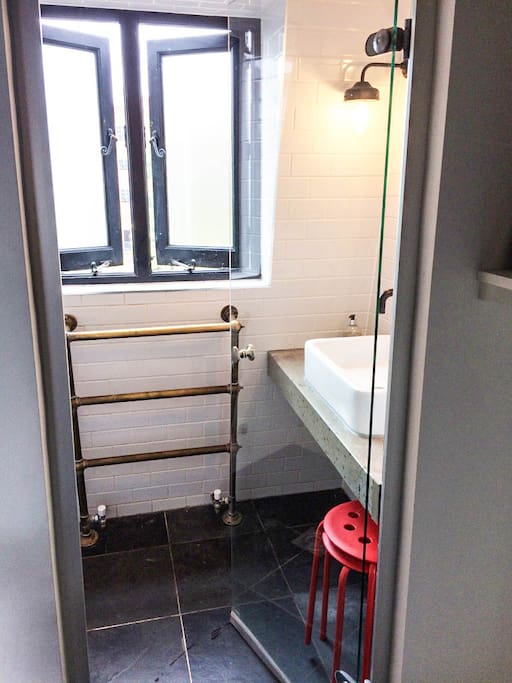 Large en-suite wet room with steam sauna, high pressure shower and basin