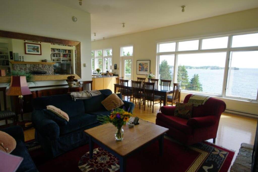 Spacious and comfortable living area with stone fireplace