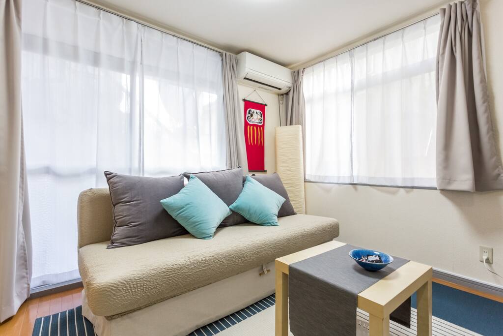 Spacious living room area with comfortable 3 person sofa