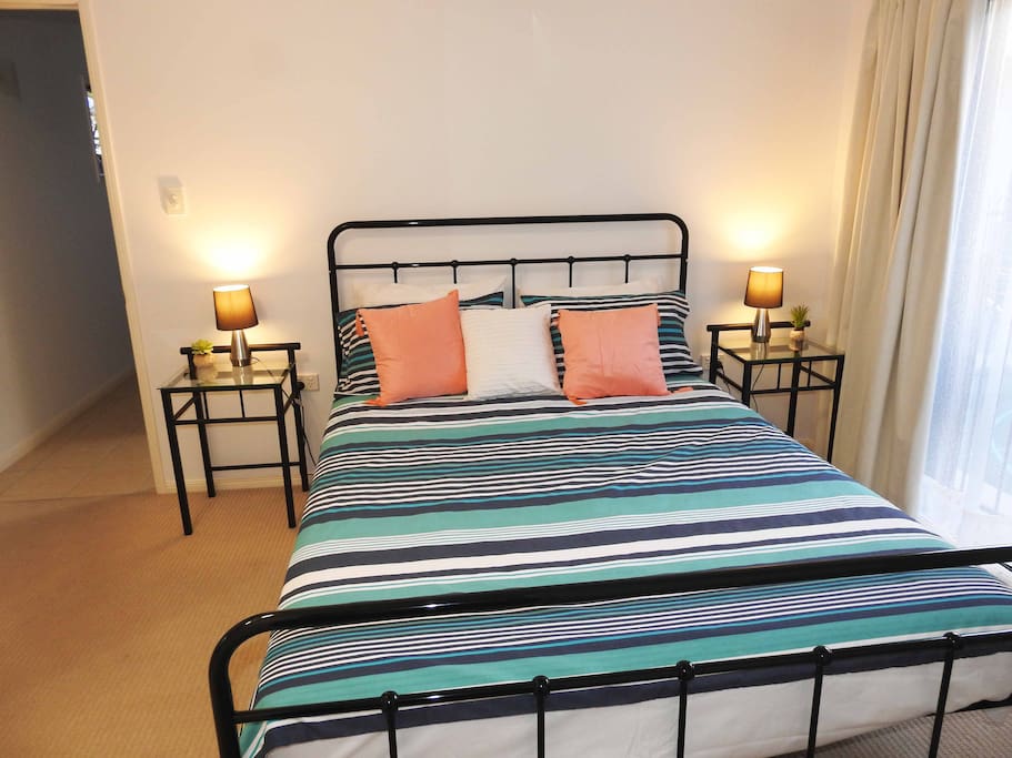 "Mossman" bedroom boasts a comfortable Queen size bed and overlooks the pool