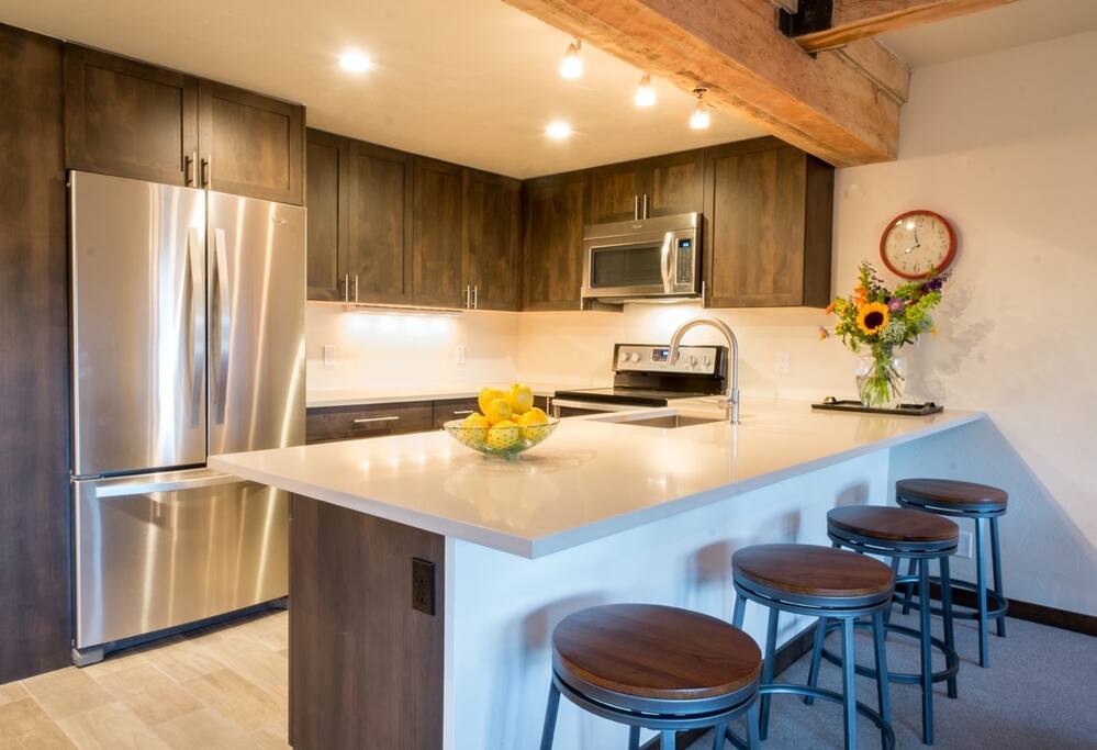 Beautiful kitchen with stunning quartz counters and plenty of storage.