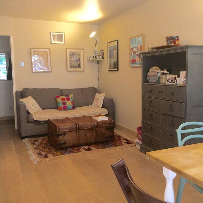 Comfortable sofa bed within spacious living room - black out blinds throughout