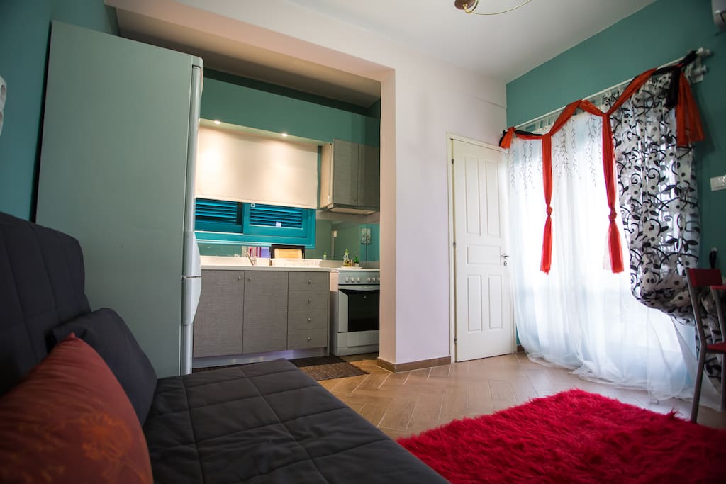 Interior room and door to the balcony with sea view