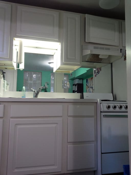 Kitchen with microwave, range.