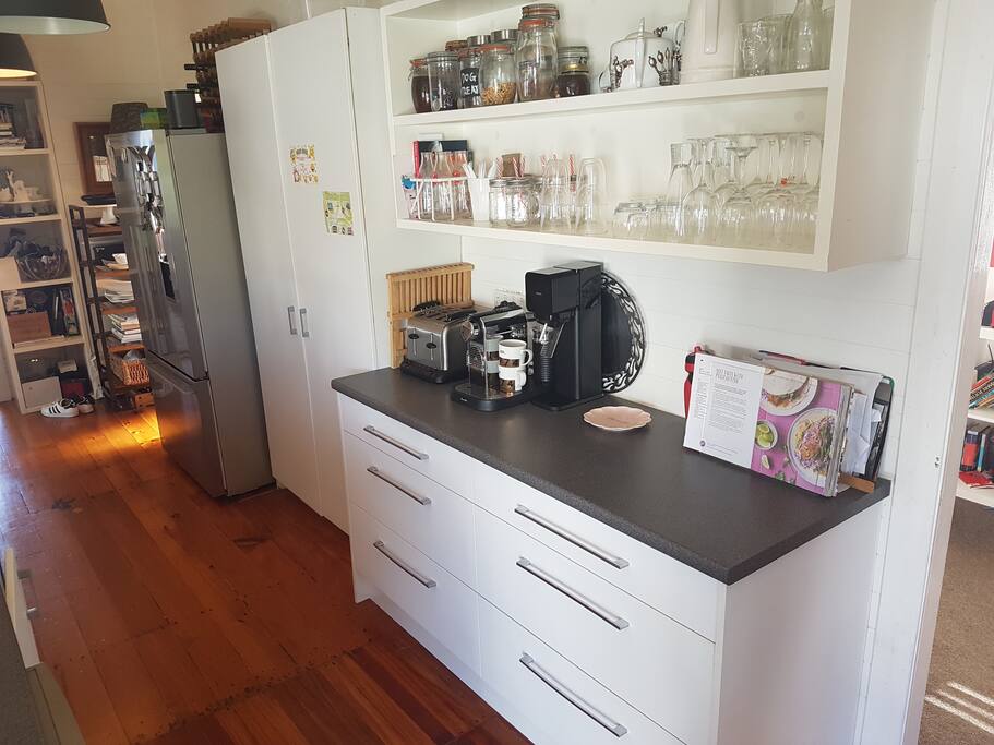 Modern kitchen includes double door fridge, pyrolytic oven and Nespresso machine