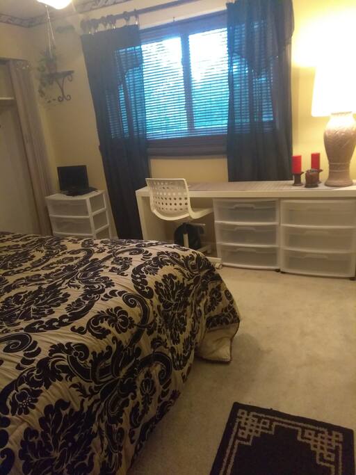 Bedroom with desk area and sunny window overlooking backyard!