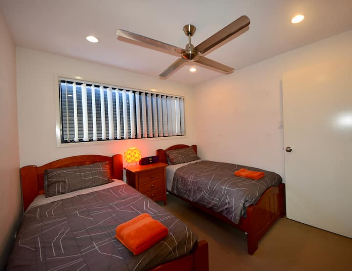Third bedroom twin single bed.  Build in robe with drawers