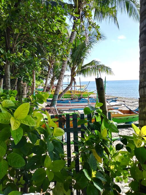 Beach front just few steps outside the perimeter, boats ready for island hopping anytime.