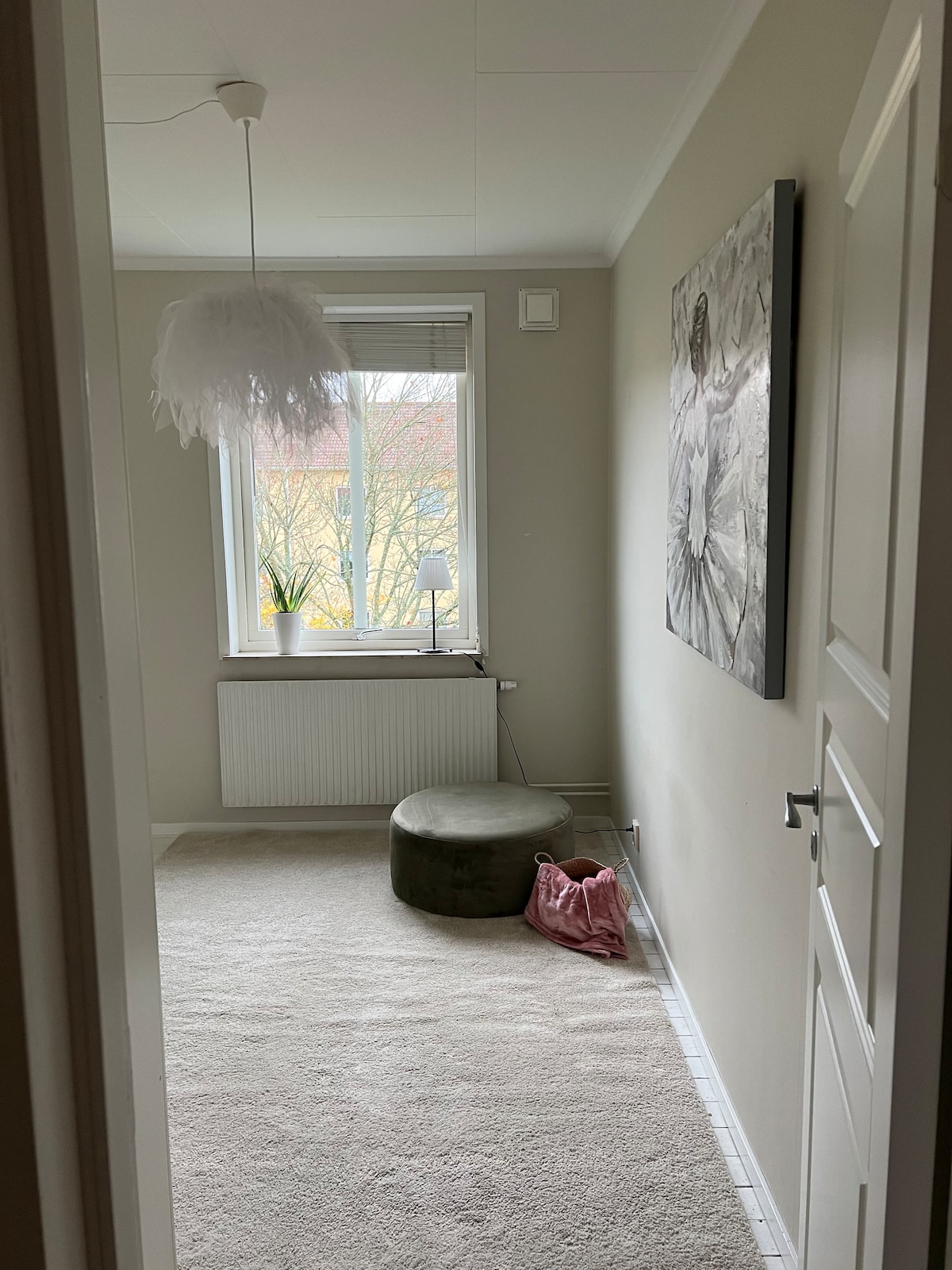 The second bedroom with 2 beds as well as wardrobes for either two people. Bright room with the garden view through the window.