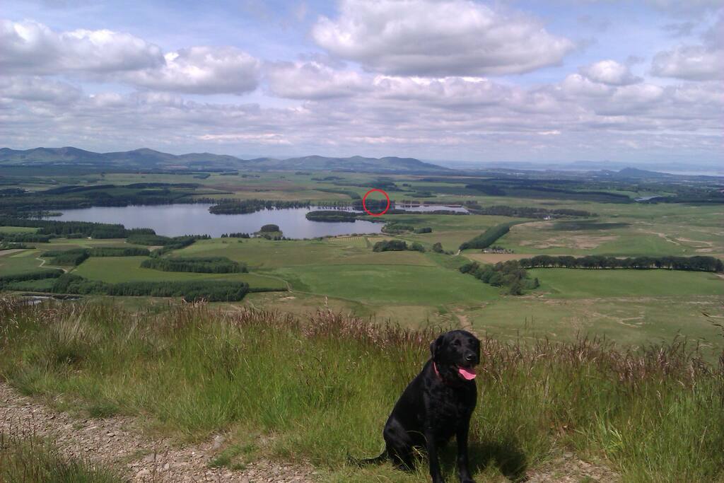 Looking down on the reservoir from the hills opposite. Location of our house circled in red. The city of Edinburgh is in the distance on the right.