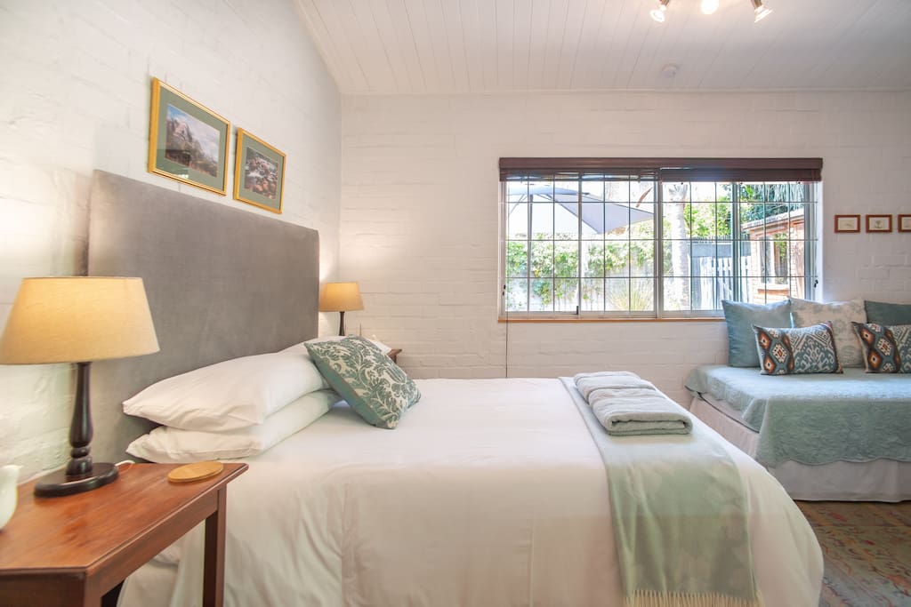 The studio is a restful space with a very comfortable double bed and a single bed suitable for an adult or a child. There is also a camp cot for infants.