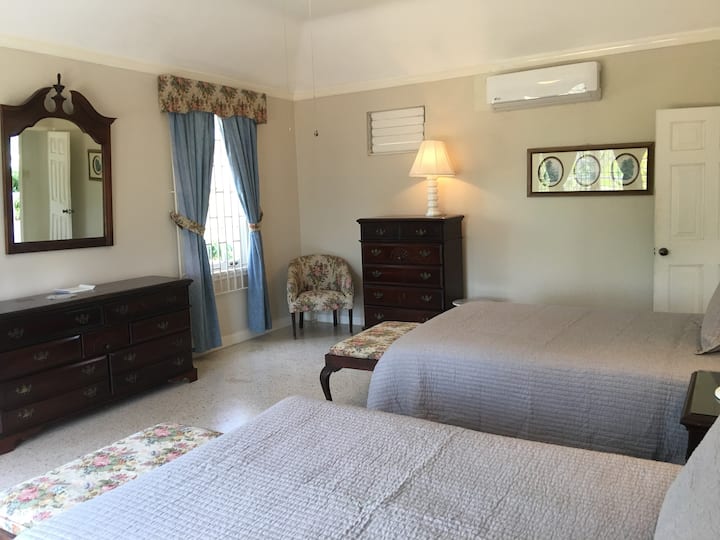 Two double beds in the North Guest Wing room