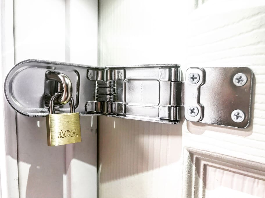 All Listings at 3522 W. Flournoy St. will contain an External Fixture on the Bedroom Door to which a Padlock can be attached.
(Note: Actual apparatus might differ slightly based on Style & Soze of Door)
In order to ensure 100% Safety & Security we will NOT provide a Lock. Guests are encouraged to bring their own or they may purchase a Brand New MasterLock Combination Lock, on site, for a Small additional fee.