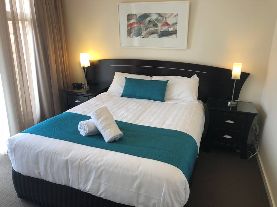 Queen bed in main bedroom