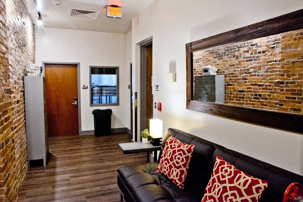 The hallway has a futon, bathrooms, and vintage lockers for extra storage!