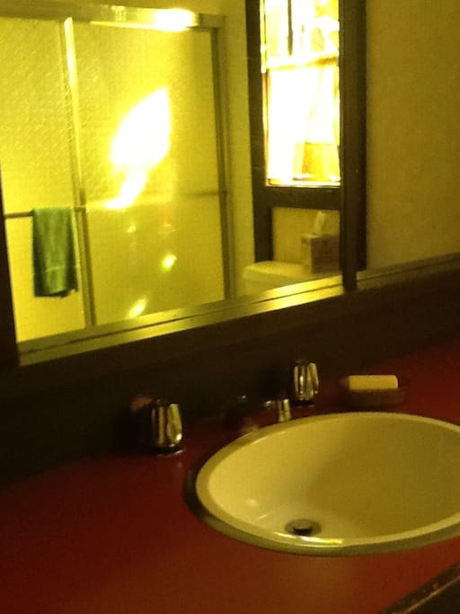 Bathroom with stained glass window.