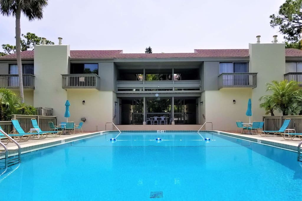 Heated Pool with plenty of lounge chairs and umbrellas for those warmer days.