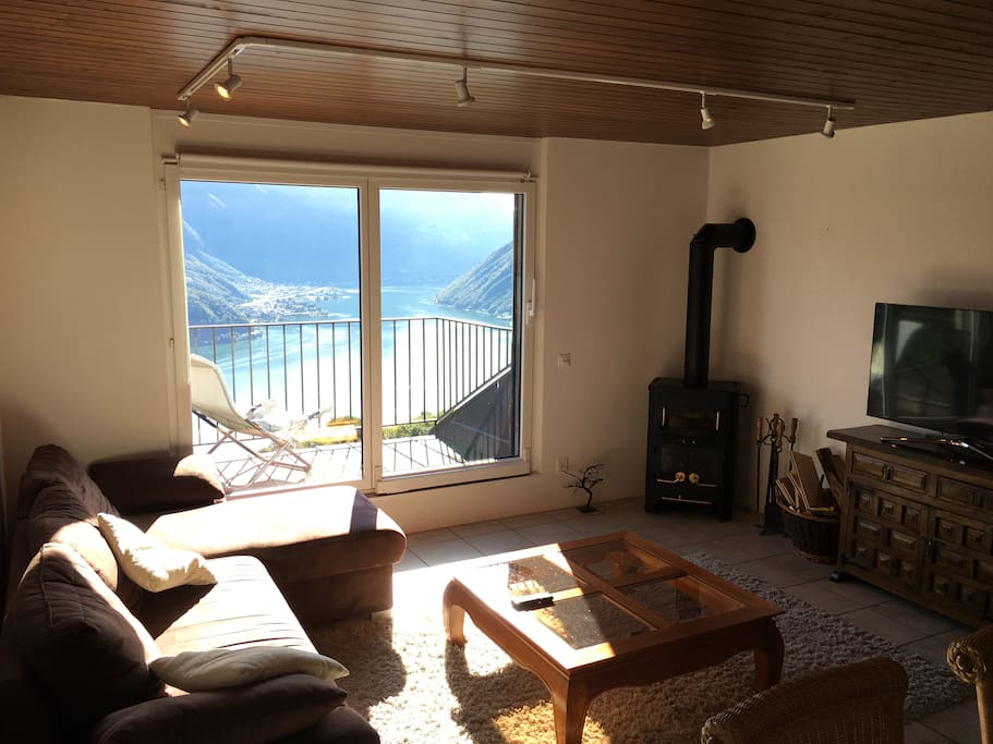 Another shot of the living room and in the background is lake Lugano.