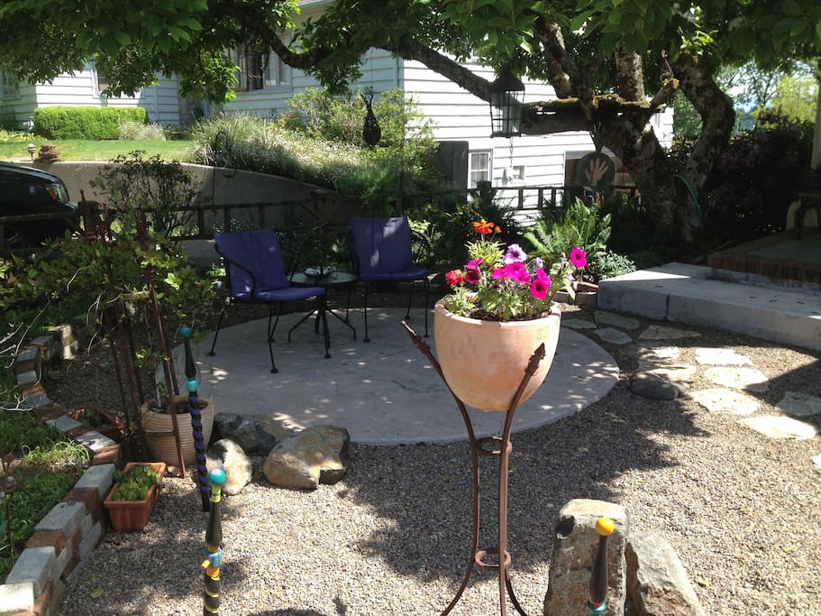 Inviting front yard patio makes for easy relaxing in the shade.